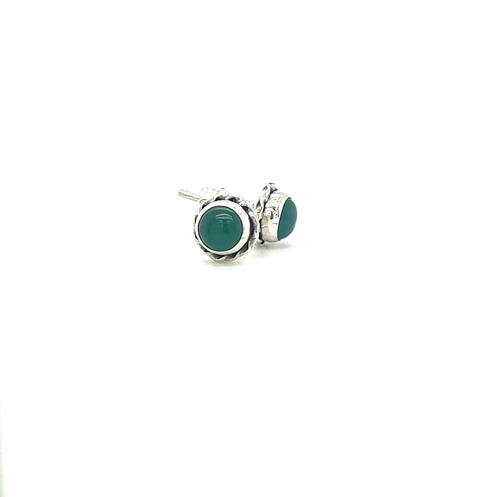 
                  
                    A pair of Round Stone Stud Earrings with Twist Details from Super Silver showcasing the vibrant green color of the stones against a white background.
                  
                