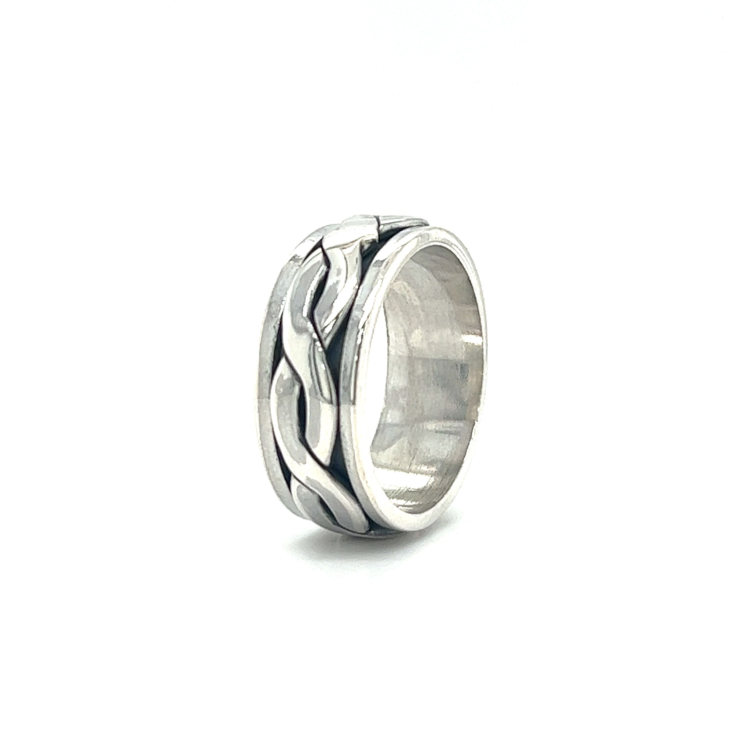 A sterling silver ring with a Sleek Woven Spinner Band.