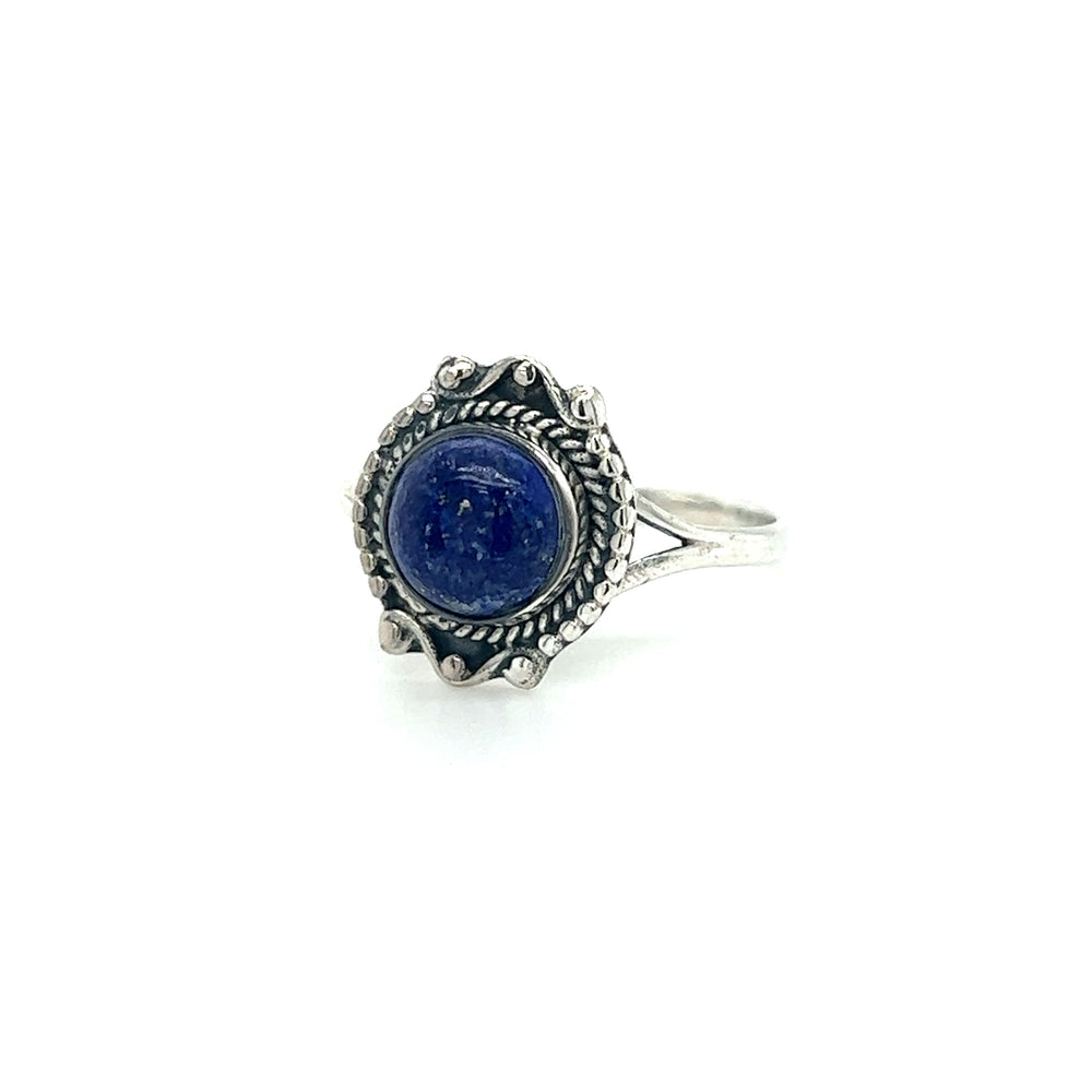 
                  
                    A silver Round Gemstone Ring With Vintage Setting adorned with a mesmerizing lapis stone.
                  
                