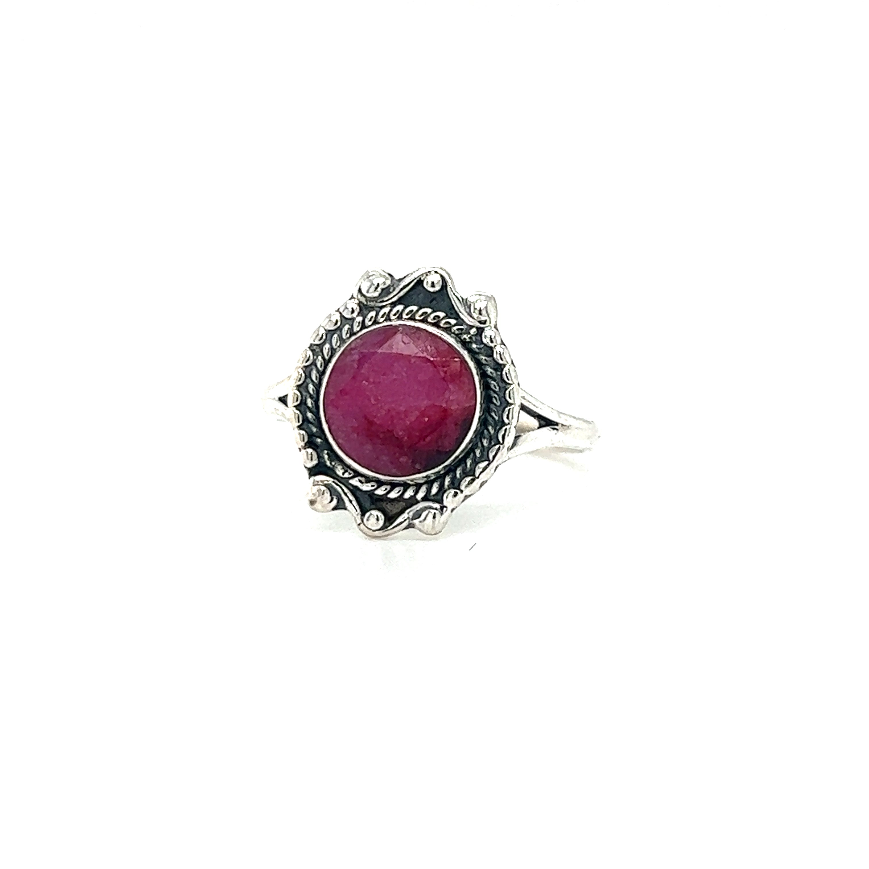 A vintage-style Super Silver Round Gemstone Ring With Vintage Setting featuring a ruby gemstone, exuding bohemian sophistication.