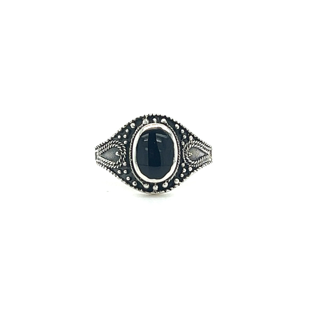 
                  
                    A Vintage Style Oval Shield Ring with Inlaid Stones.
                  
                