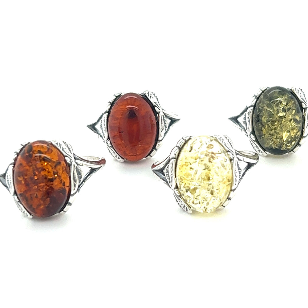 
                  
                    Beautiful Dragonfly Band Amber Ring set in a stunning Super Silver sterling silver dragonfly band.
                  
                