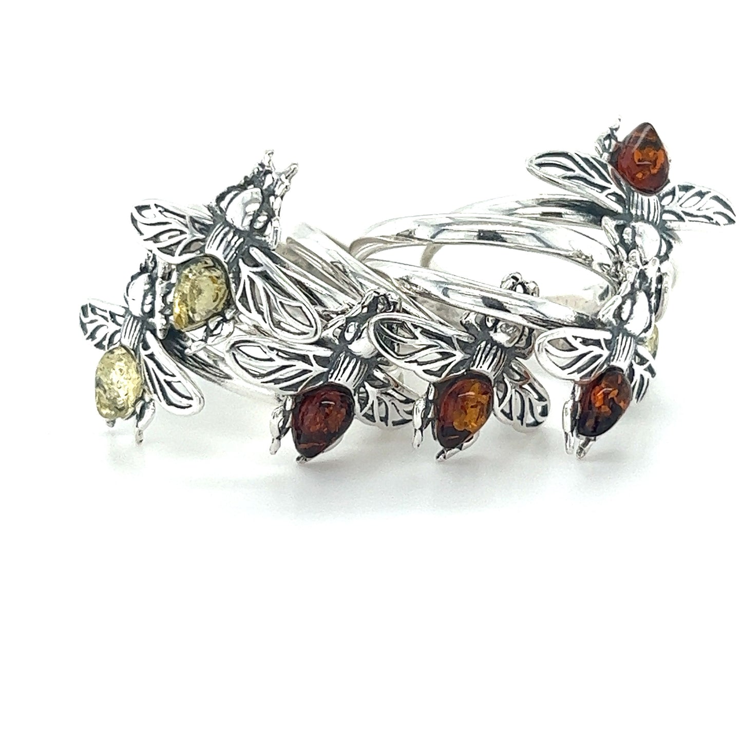 
                  
                    A Detailed Baltic Amber Bee Ring adorned with amber stones made by Super Silver.
                  
                