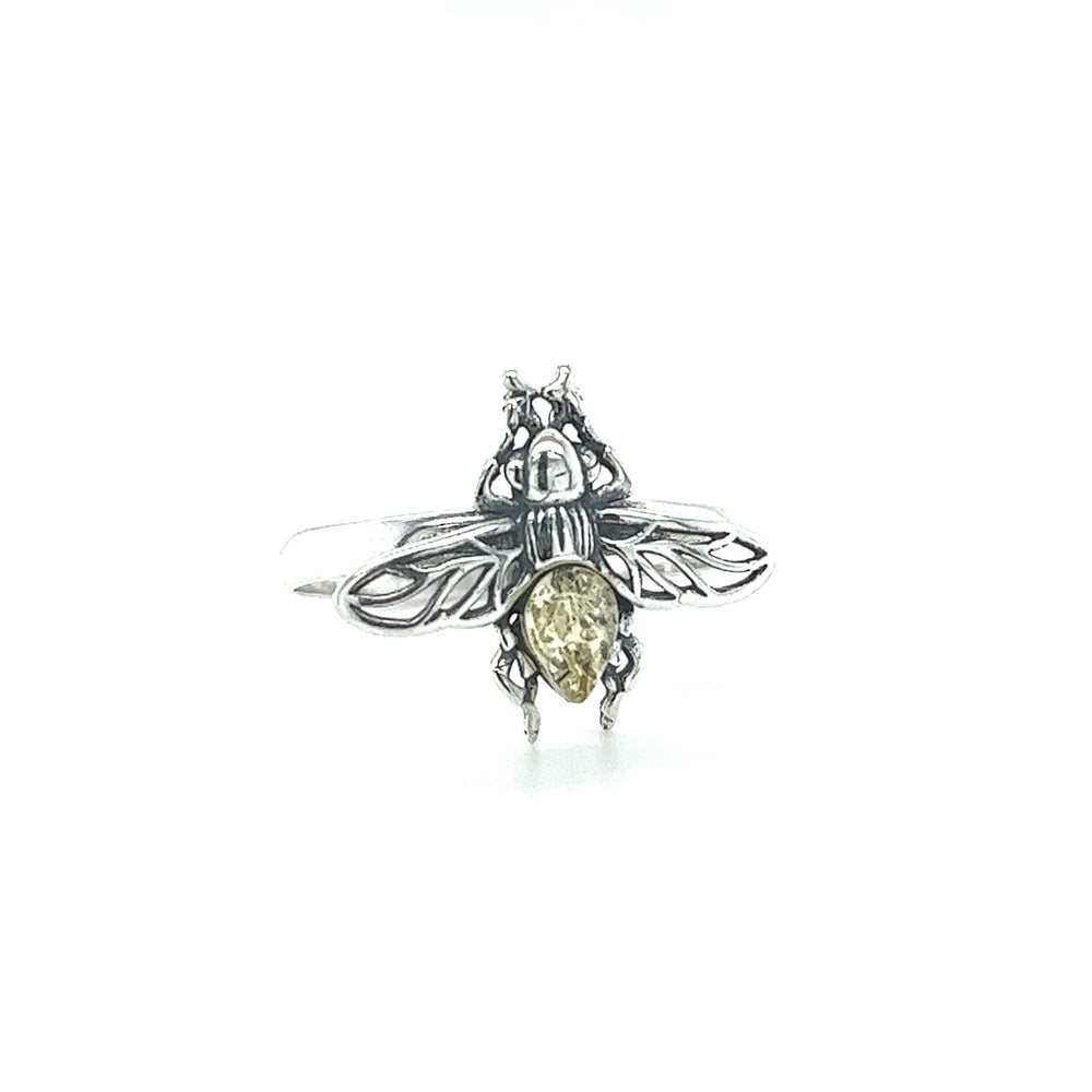 
                  
                    A Detailed Baltic Amber Bee Ring by Super Silver with a silver bee on it.
                  
                