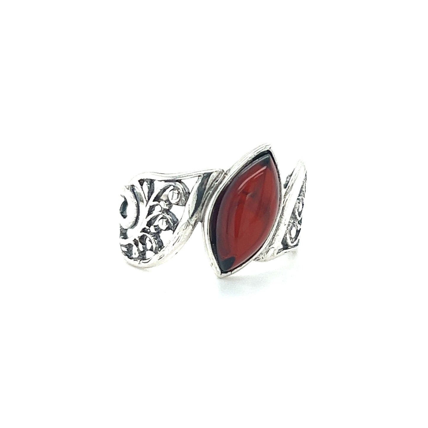 
                  
                    A Wide Filigree Band Baltic Amber Ring with a red stone from Super Silver.
                  
                