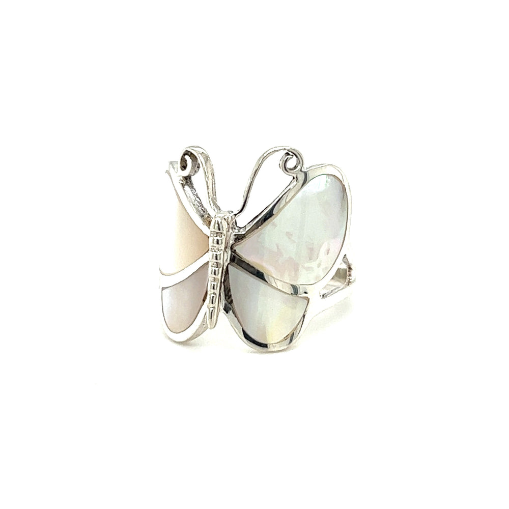 
                  
                    A Bold Butterfly Ring with Inlaid Stones with a mother of pearl stone on a white background.
                  
                
