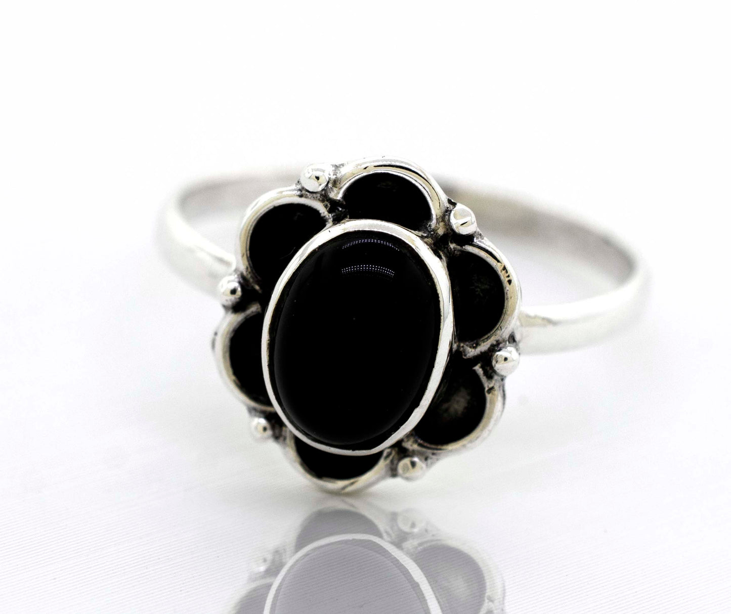 
                  
                    A delicate Super Silver Gemstone Ring With Oxidized Flower Design with a central black onyx gemstone.
                  
                