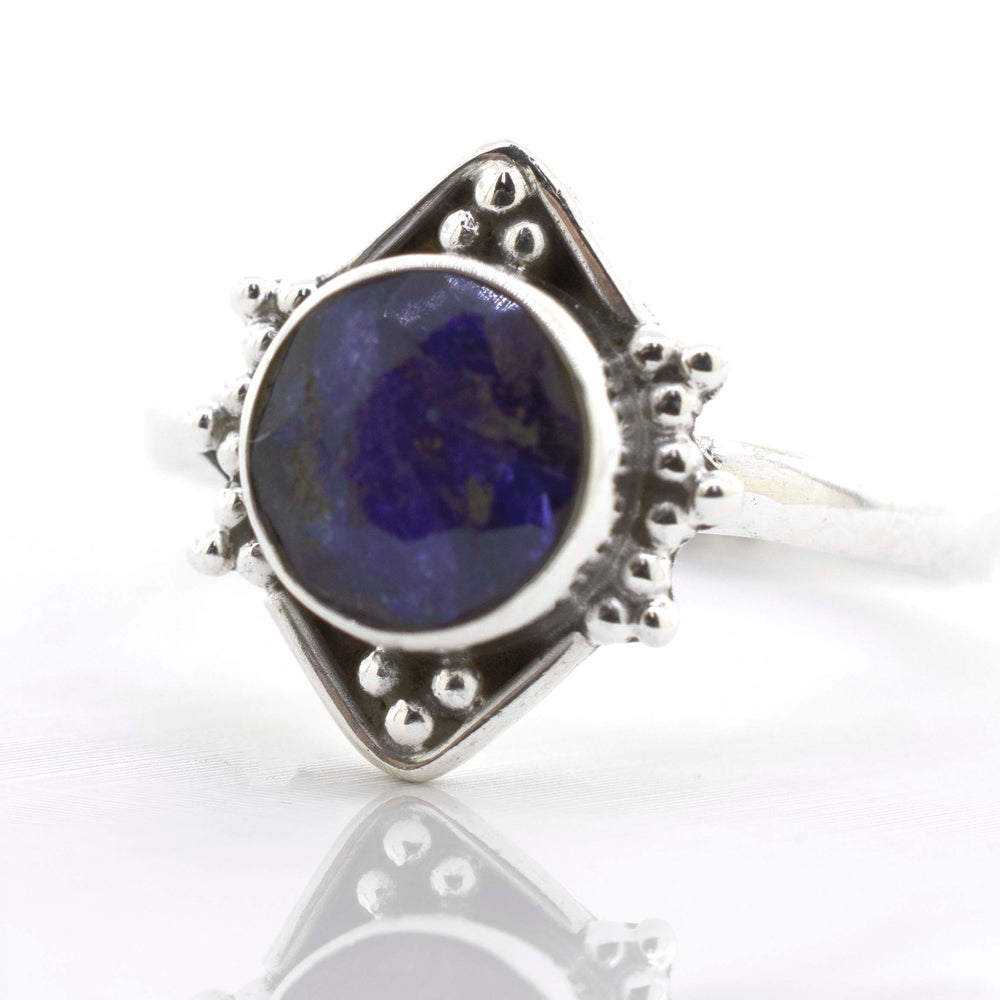 
                  
                    A Super Silver round gemstone ring with oxidized diamond shape pattern.
                  
                