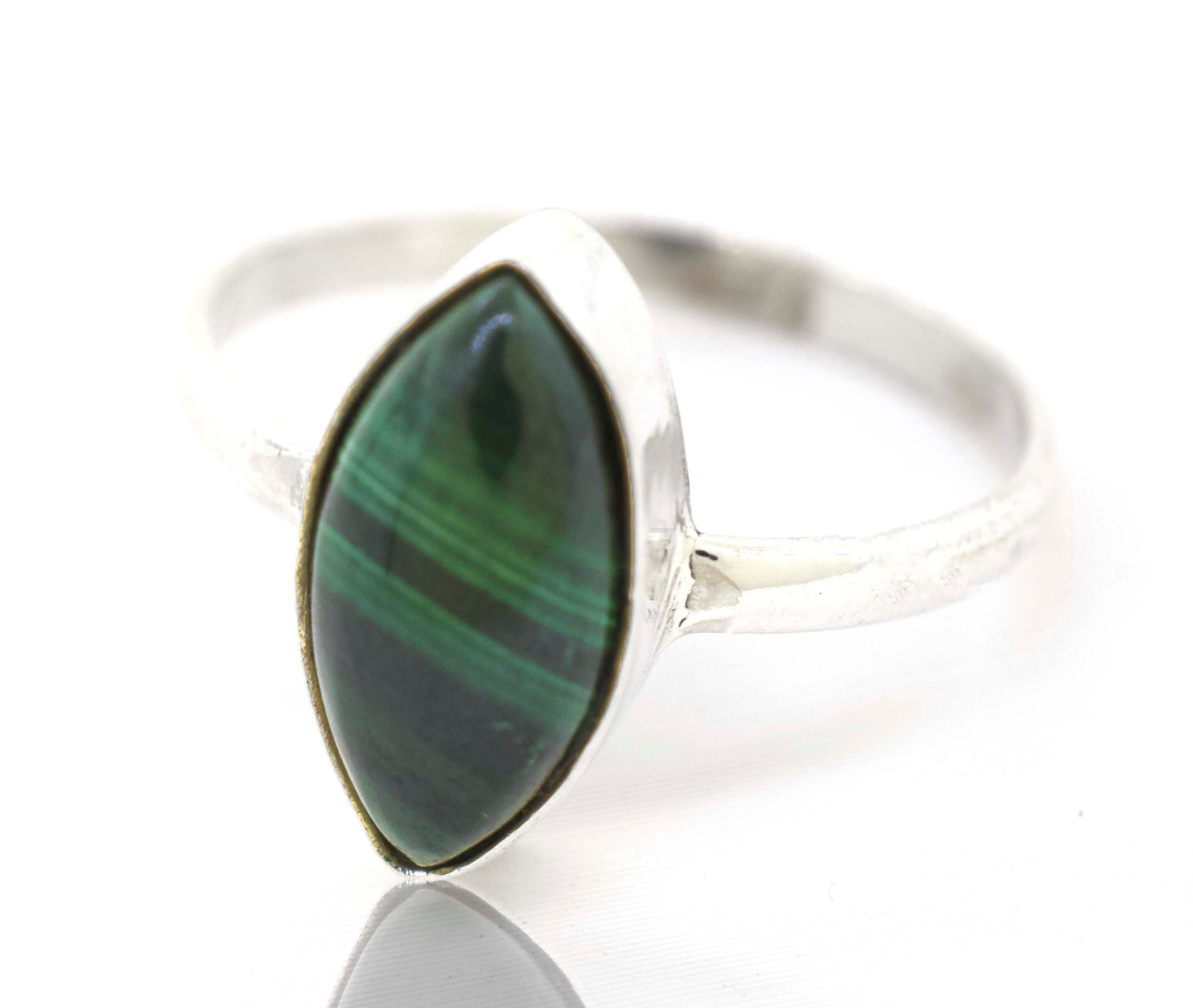 A Super Silver Simple Marquise Shaped Gemstone Ring with a green gemstone.