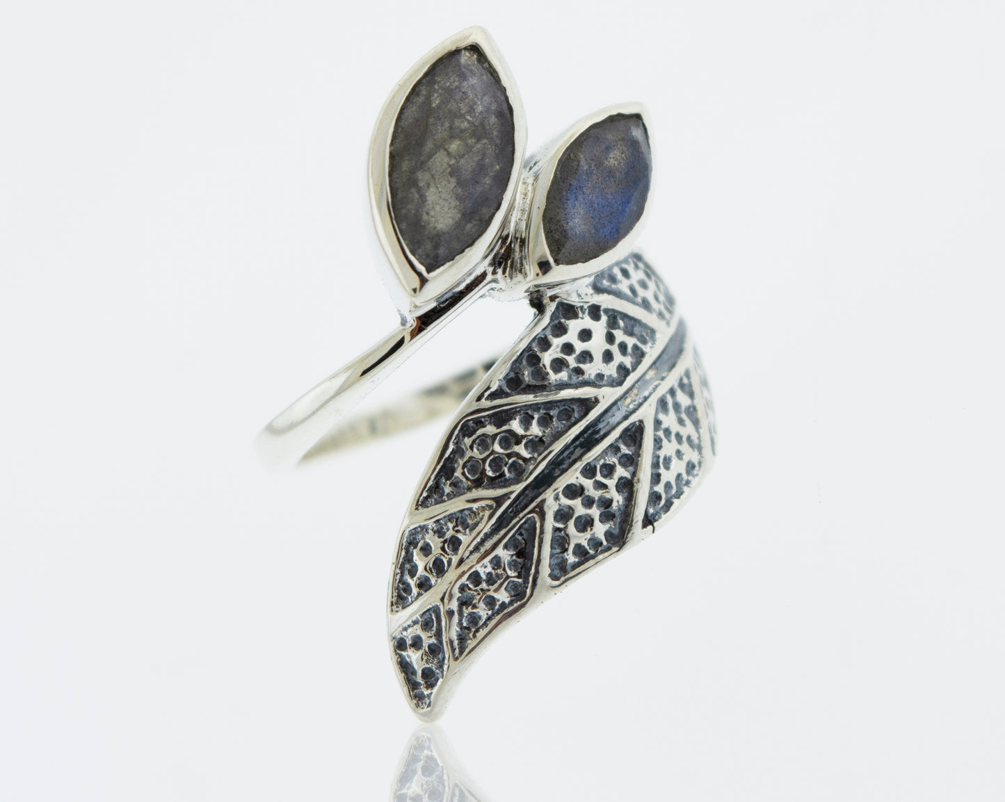 
                  
                    A Super Silver Leaf Ring with Labradorite adorned with two exquisite leaves and a mesmerizing labradorite stone.
                  
                
