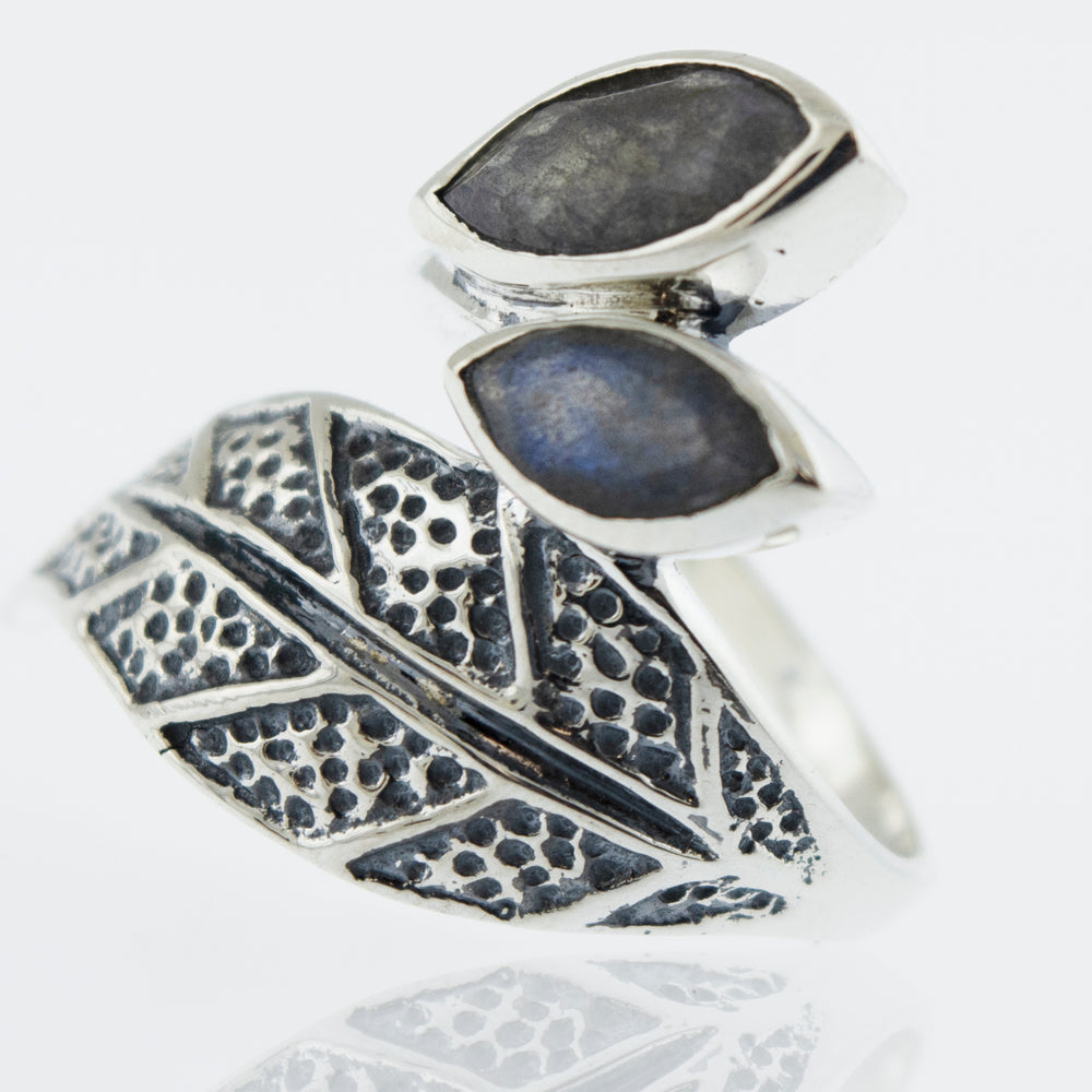 
                  
                    A Super Silver Leaf Ring with Labradorite, adorned with two delicate leaves and a mesmerizing labradorite stone.
                  
                