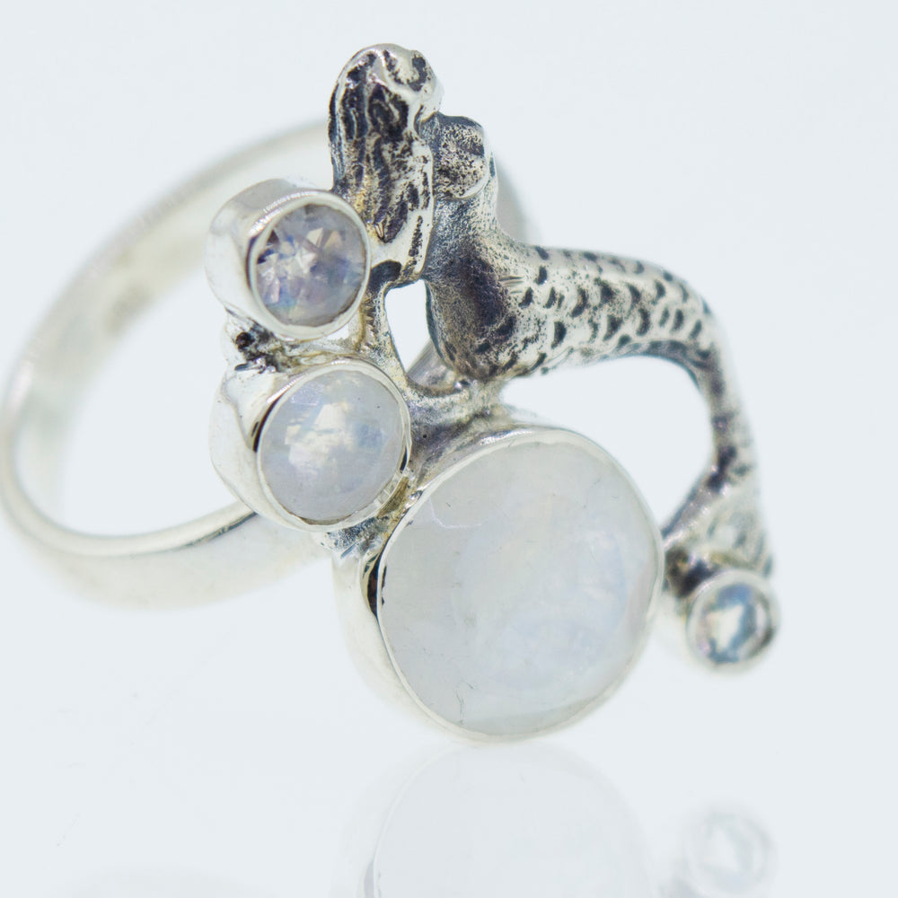 
                  
                    Mermaid Ring with Moonstone, inspired by the serene beauty of the ocean.
                  
                