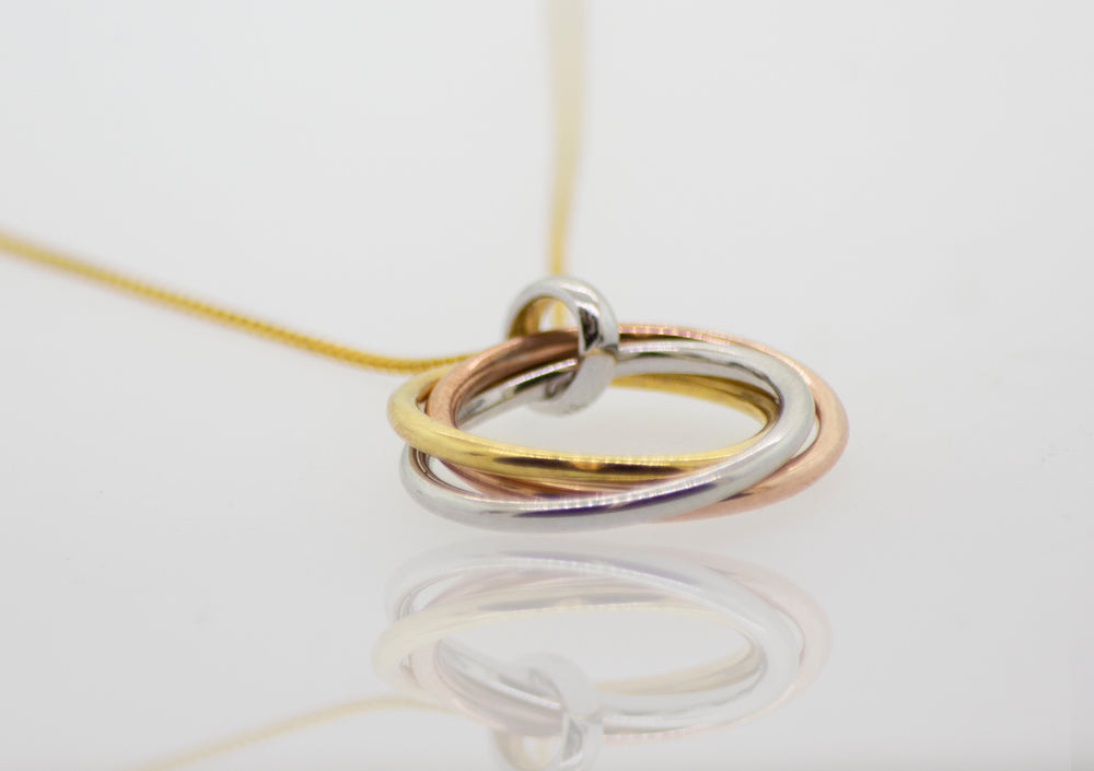 This description features a Simple and Elegant Gold and Rose Gold Plated Pendant necklace from Super Silver.