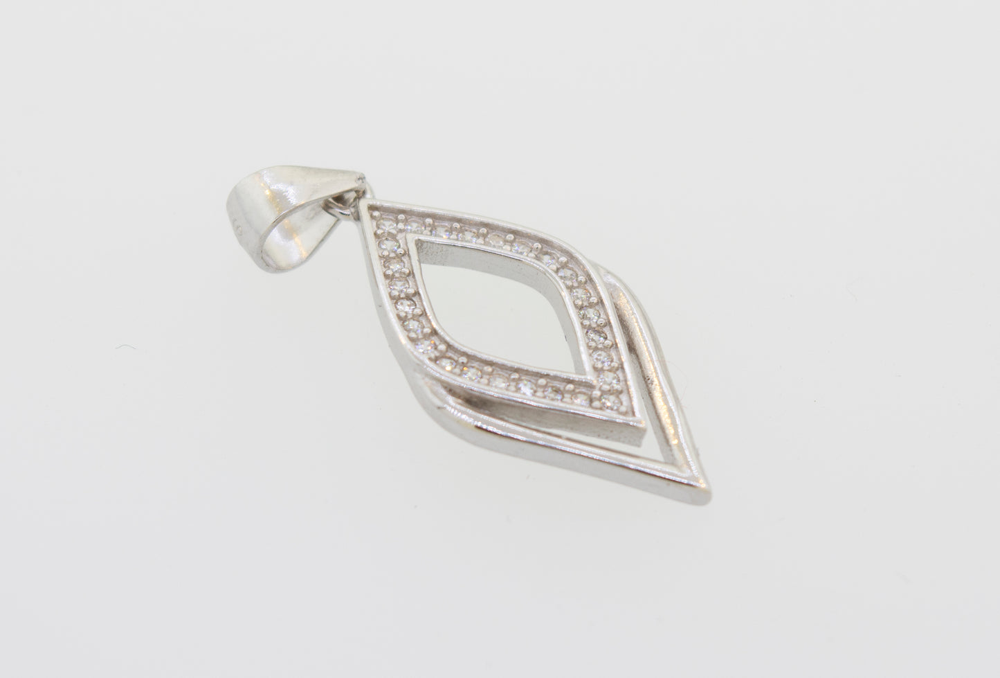 
                  
                    A Cubic Zirconia Leaf Shape Pendant made of sterling silver with cubic zirconia on a white background, from the brand Super Silver.
                  
                