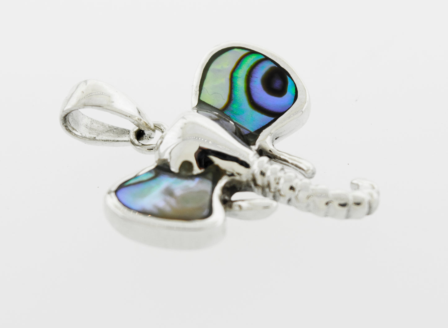 A Super Silver elephant head pendant with inlaid stone ears and blue and green eyes.