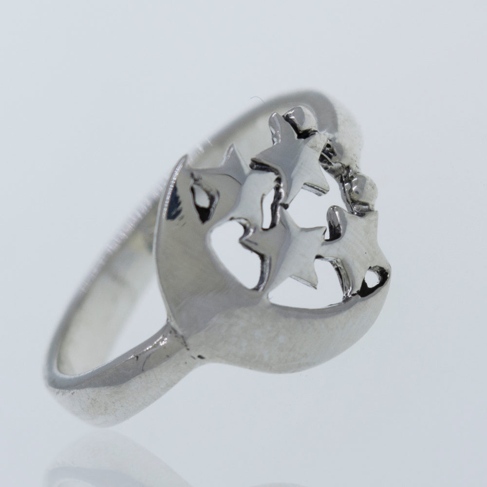 
                  
                    A Super Silver Crescent Moon Ring with Four Stars adorned with shimmering stars.
                  
                