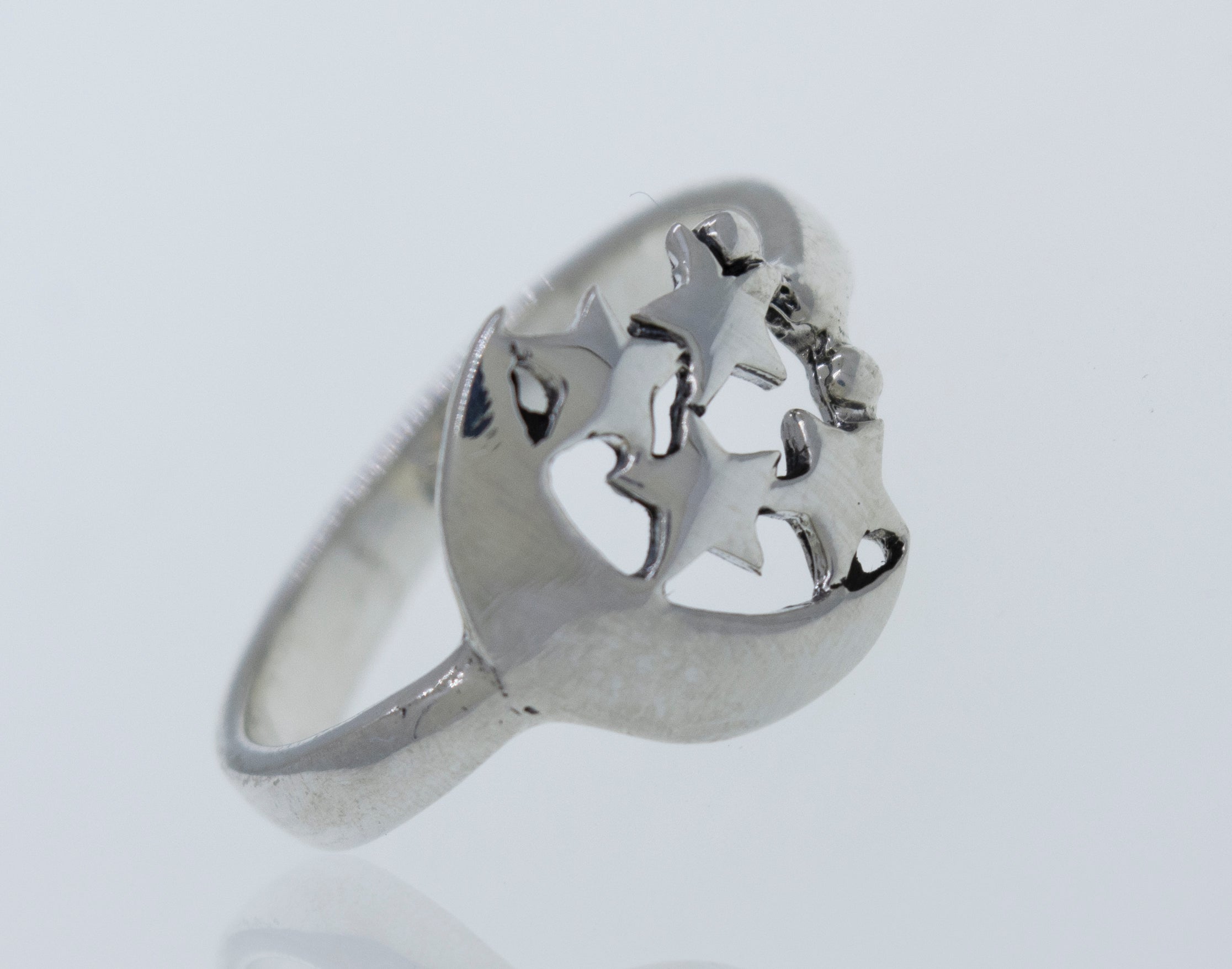 A Super Silver Crescent Moon Ring with Four Stars adorned with shimmering stars.