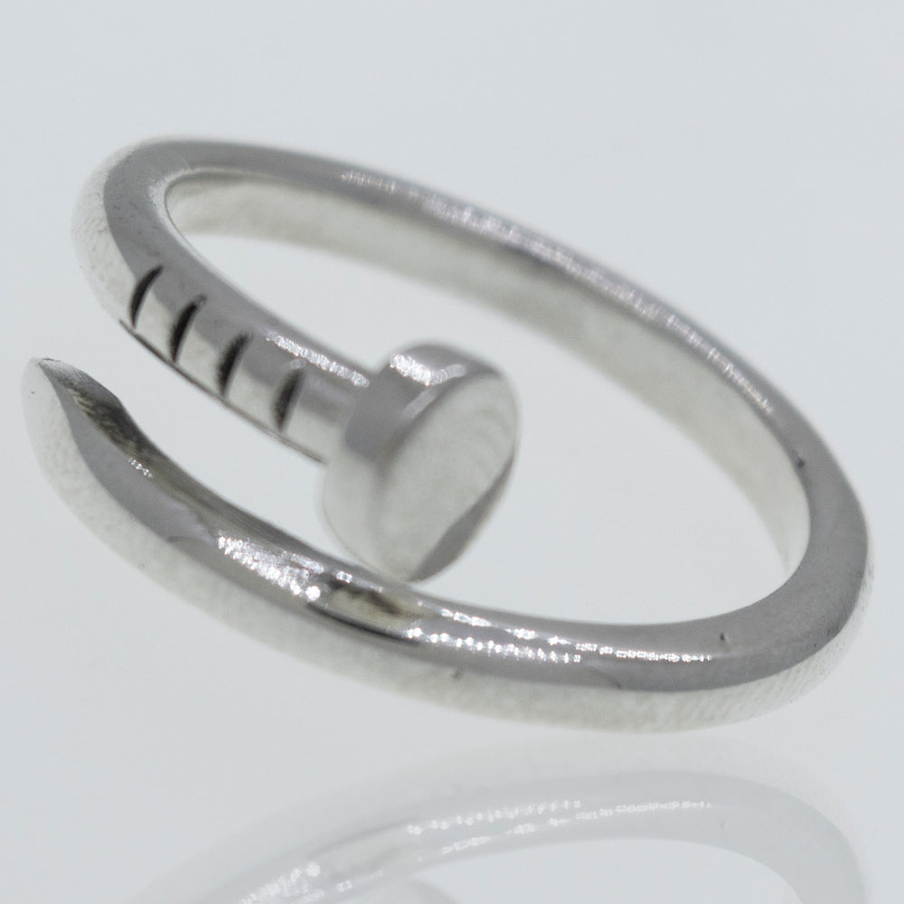 An Adjustable Nail Ring with a hook on it from Super Silver.