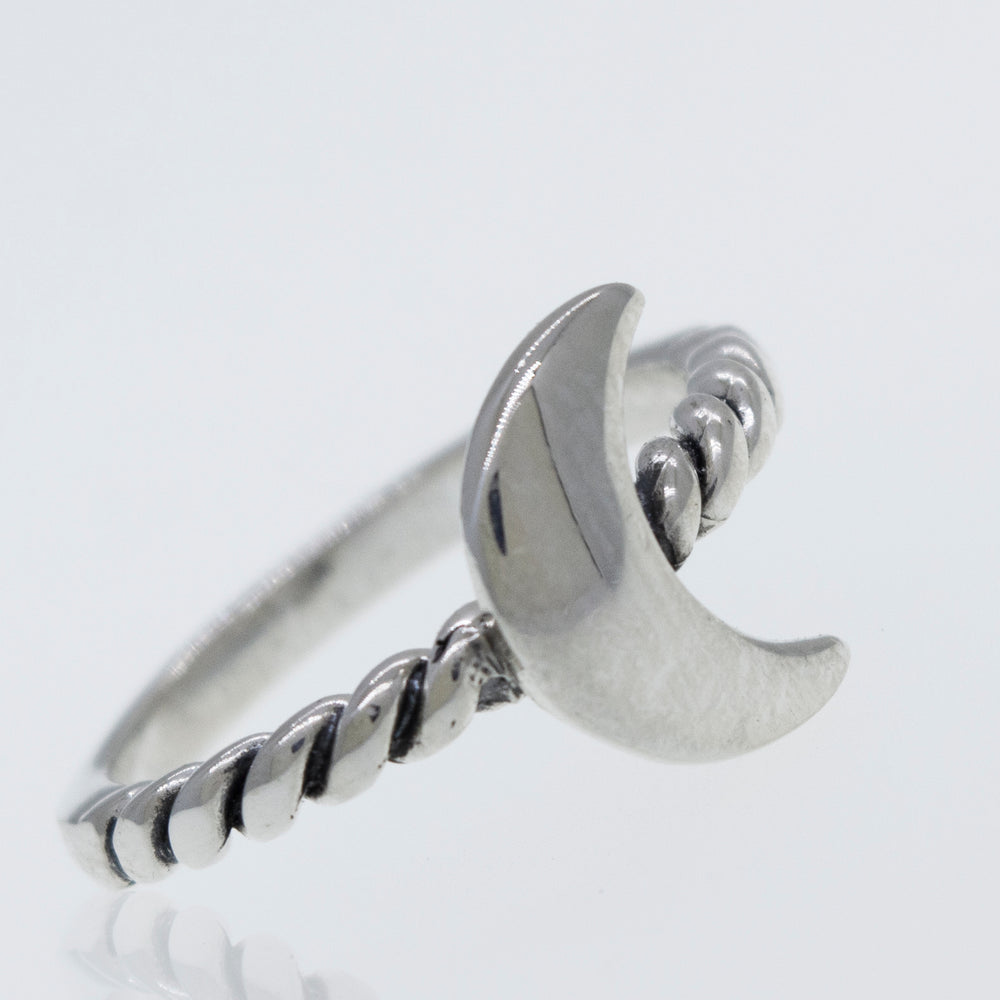 
                  
                    A Crescent Moon Ring With Rope Textured Band with a crescent on it.
                  
                
