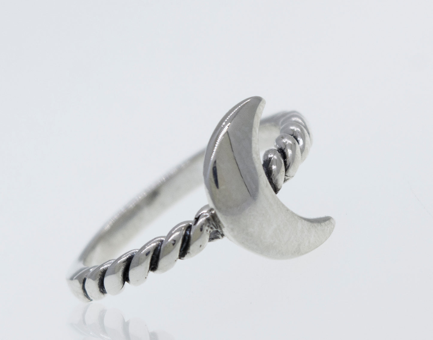 A Crescent Moon Ring With Rope Textured Band with a crescent on it.