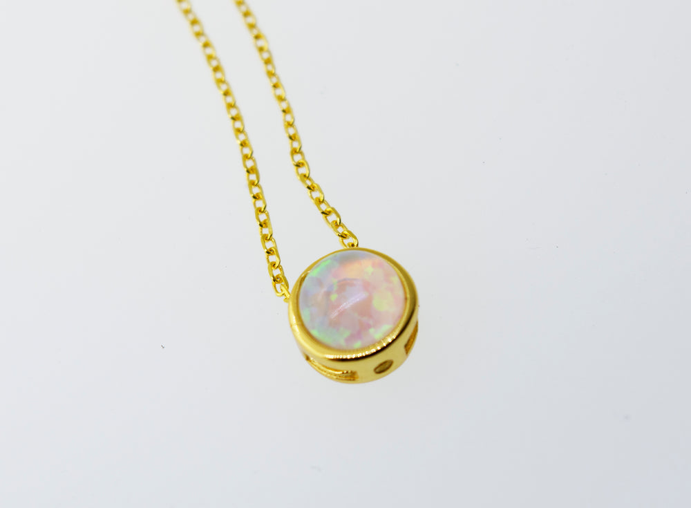 A glowing Australian opal pendant on a Super Silver gold chain.