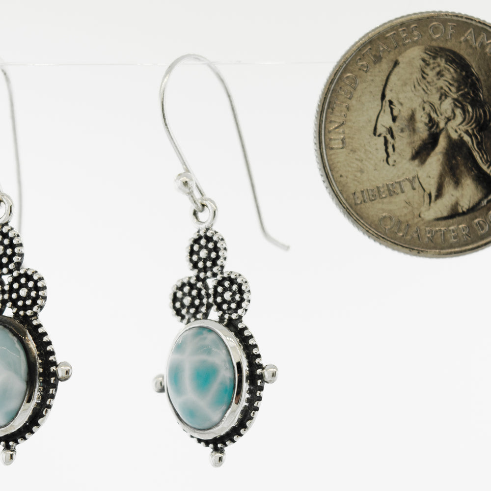 A pair of beautiful Oval Larimar Dangle Earrings with an oval Larimar stone and a quarter, made of Sterling Silver, by Super Silver.