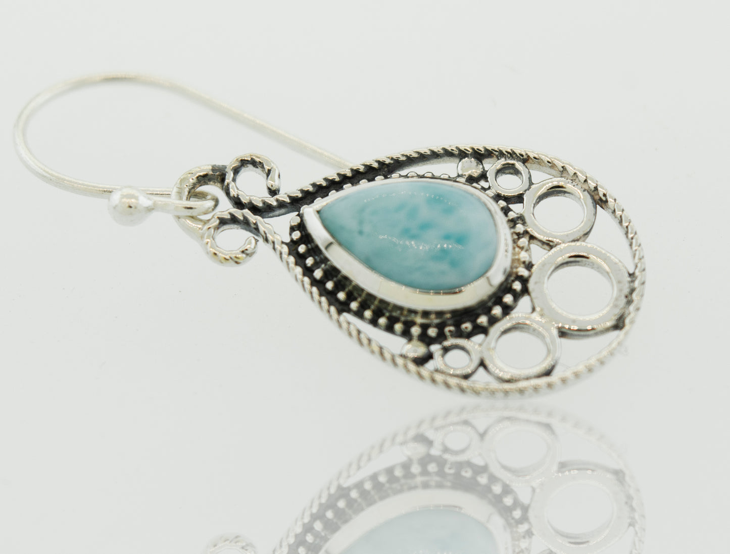 A pair of Teardrop Shape Larimar Earrings by Super Silver with a turquoise stone.