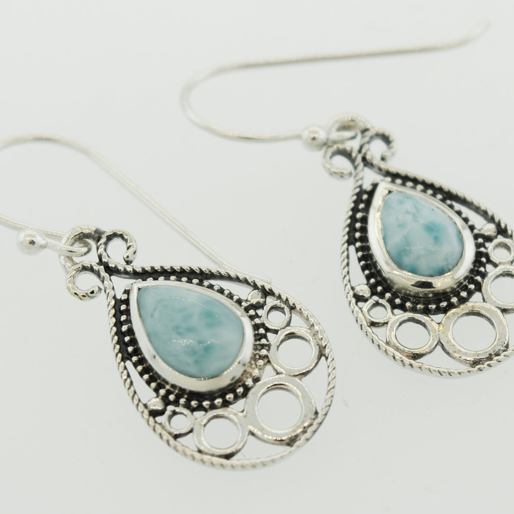 
                  
                    A pair of Teardrop Shape Larimar Earrings by Super Silver with a turquoise stone.
                  
                