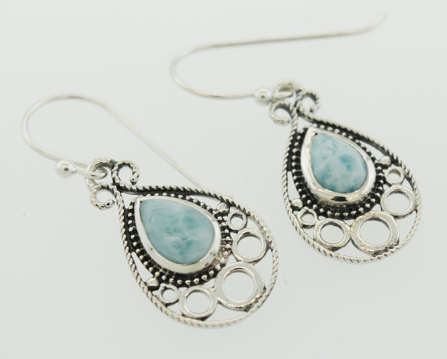 
                  
                    A pair of Teardrop Shape Larimar Earrings by Super Silver with a turquoise stone.
                  
                