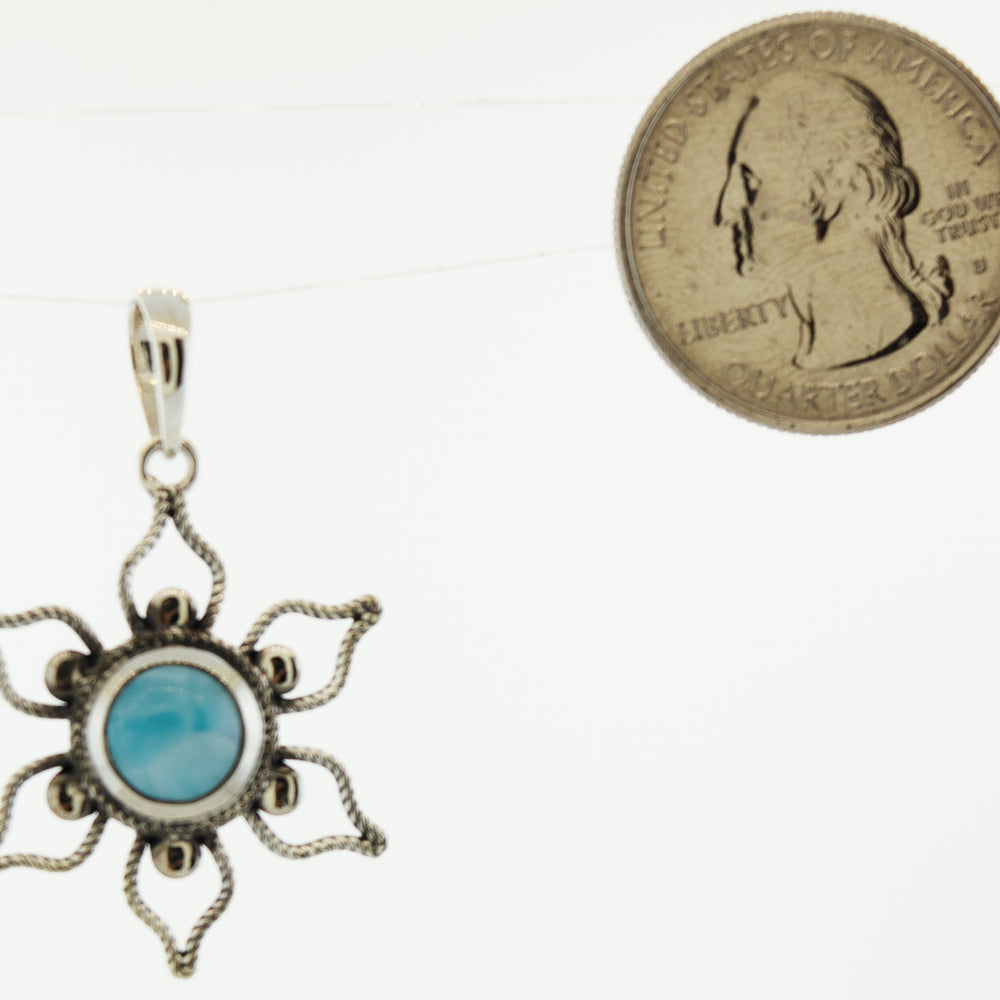 
                  
                    A Larimar Flower Pendant with a turquoise stone from Super Silver.
                  
                