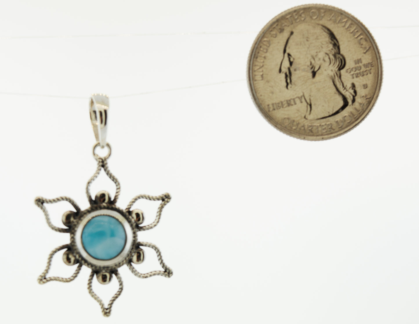 
                  
                    A Larimar Flower Pendant with a turquoise stone from Super Silver.
                  
                