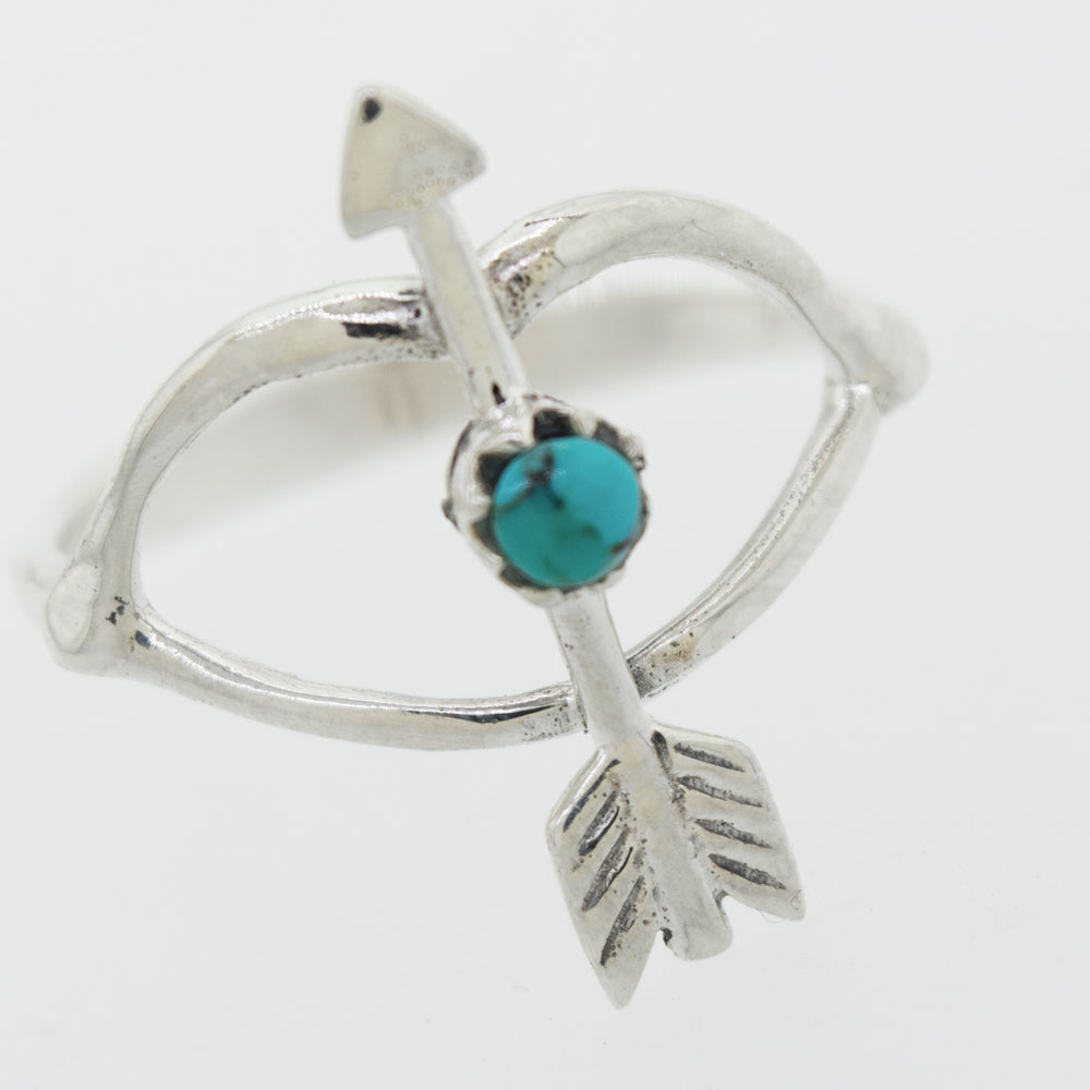 A Super Silver Turquoise Stone Ring With Bow And Arrow Design.