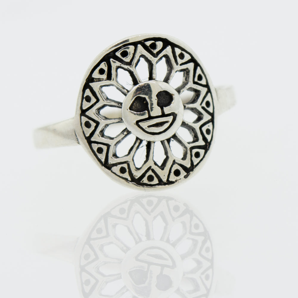 A Super Silver Silver Ring Sun With A Face with a sun design on it.