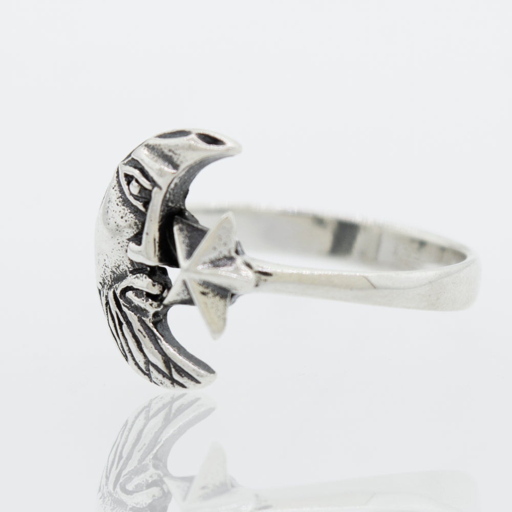 A Super Silver Man In the Moon ring with a bird on it.
