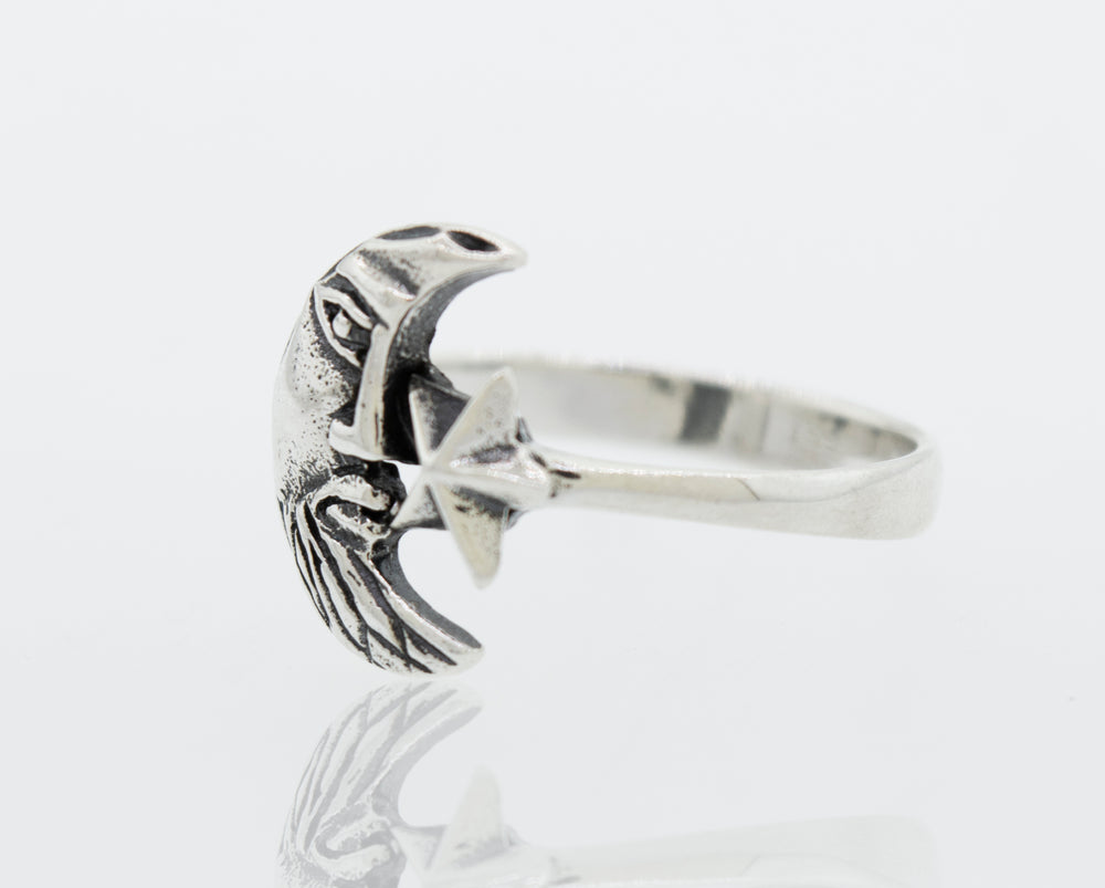 A Super Silver Man In the Moon ring with a bird on it.