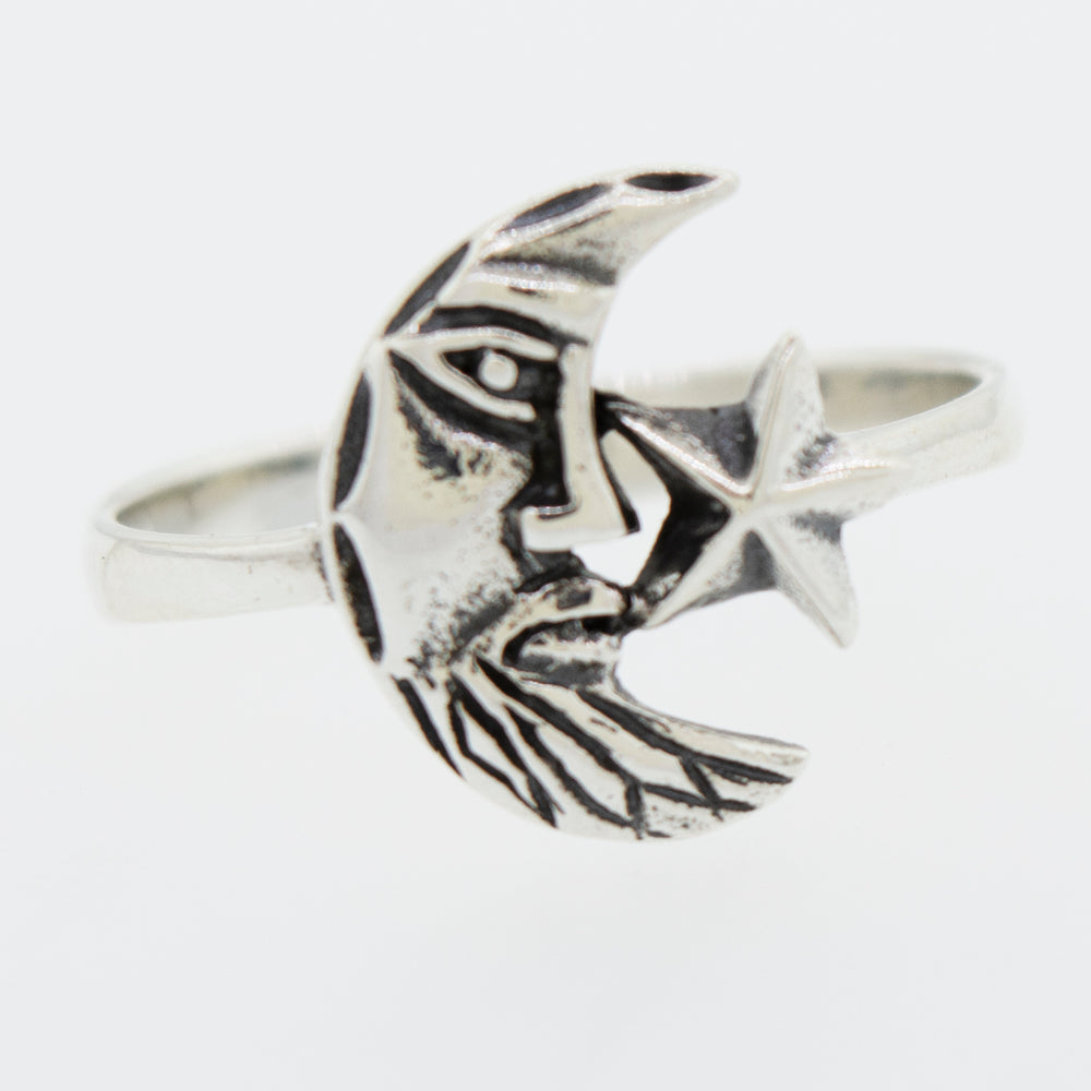 A "Man In the Moon Ring" by Super Silver, featuring a star on it.