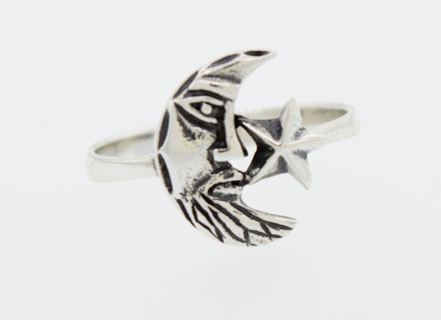 A "Man In the Moon Ring" by Super Silver, featuring a star on it.