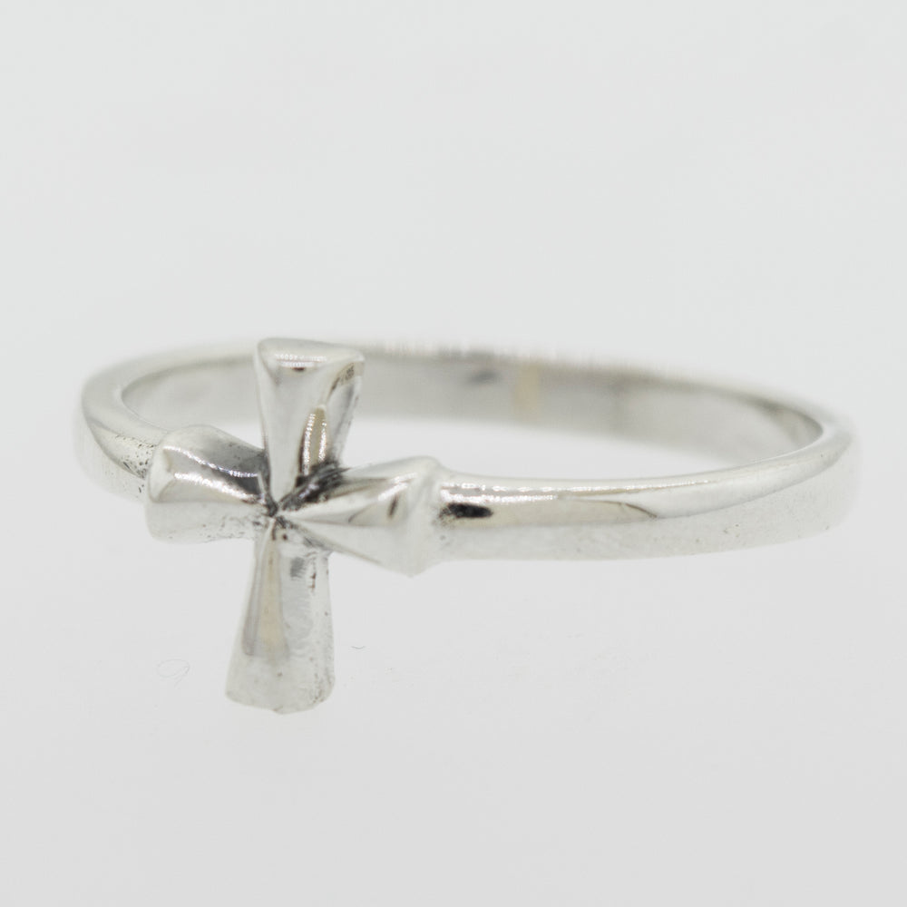 
                  
                    A Simple Cross Ring made of sterling silver, showcased on a white background by Super Silver.
                  
                