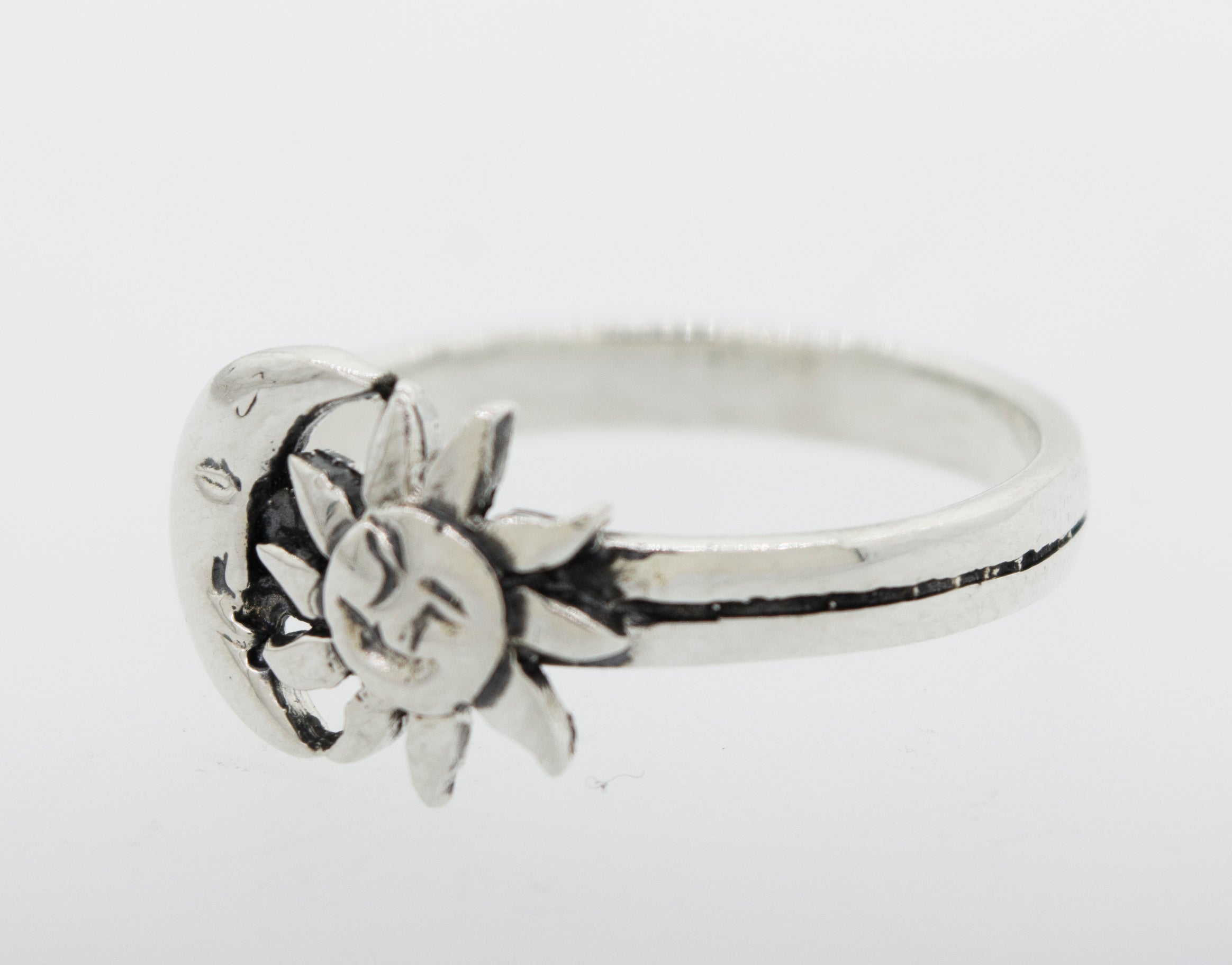 A Super Silver Moon And Sun With Face Ring, oxidized.