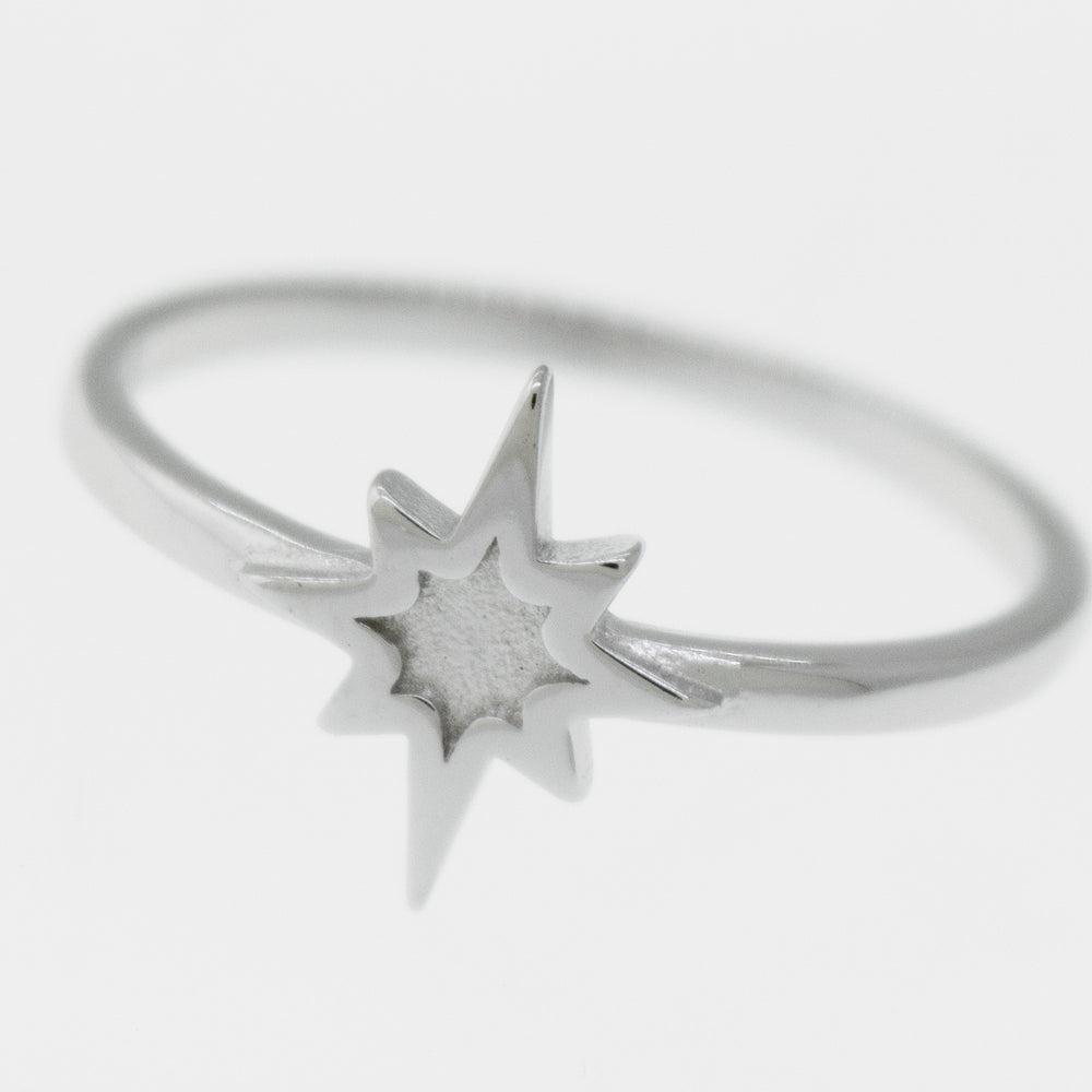 A high polish Super Silver 925 sterling silver Twinkle Star Ring with a twinkle star in the middle.