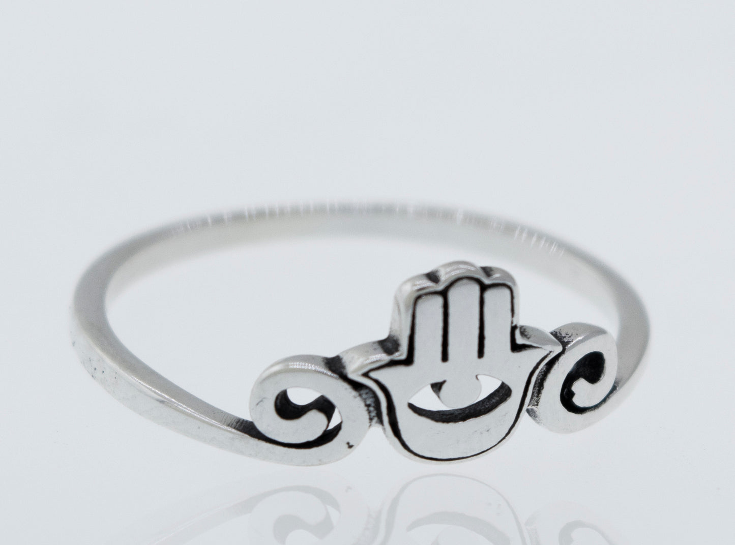 A boho-inspired Hamsa Ring with cultural significance.