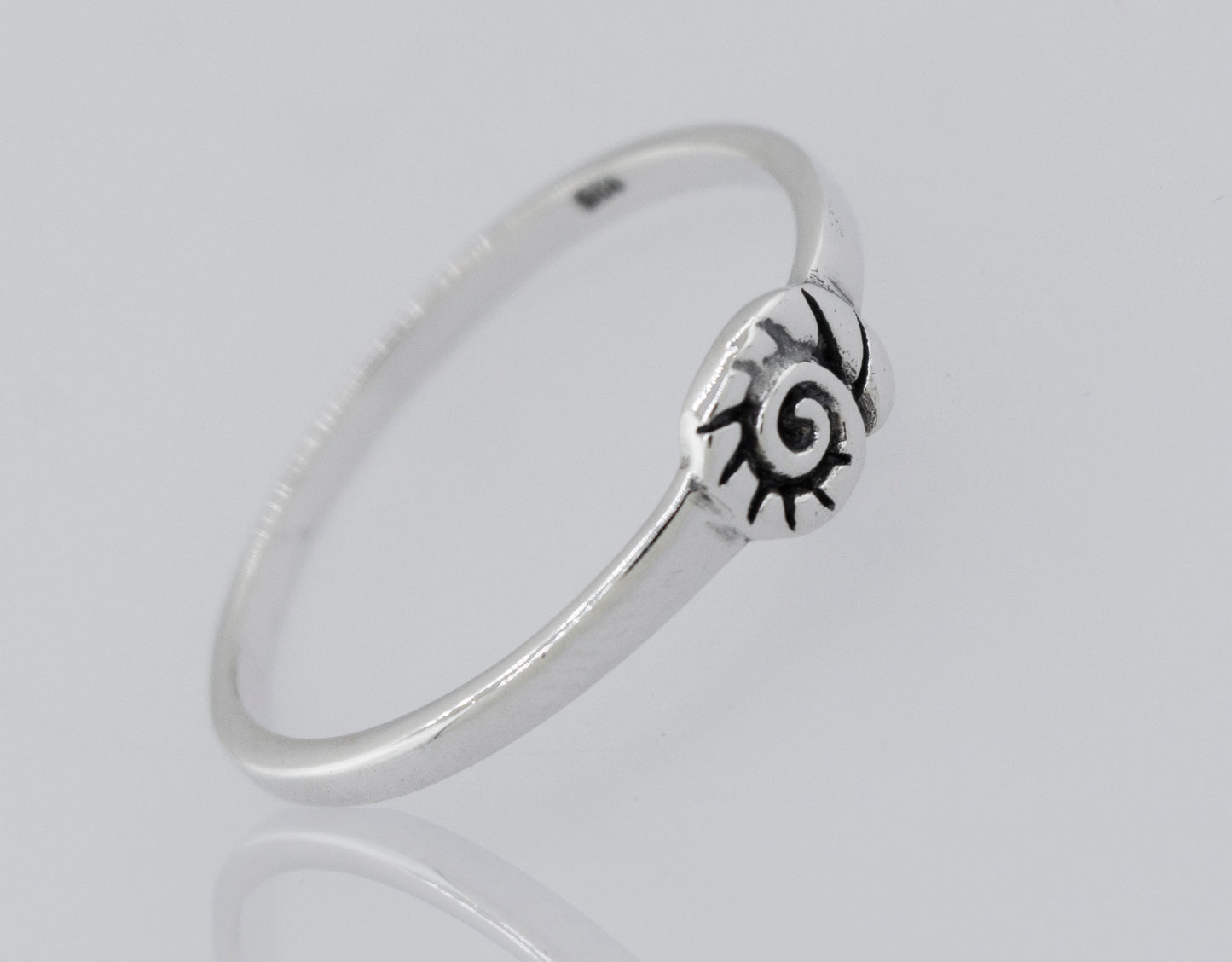 A Super Silver Shell Ring with a high polish black and white design.