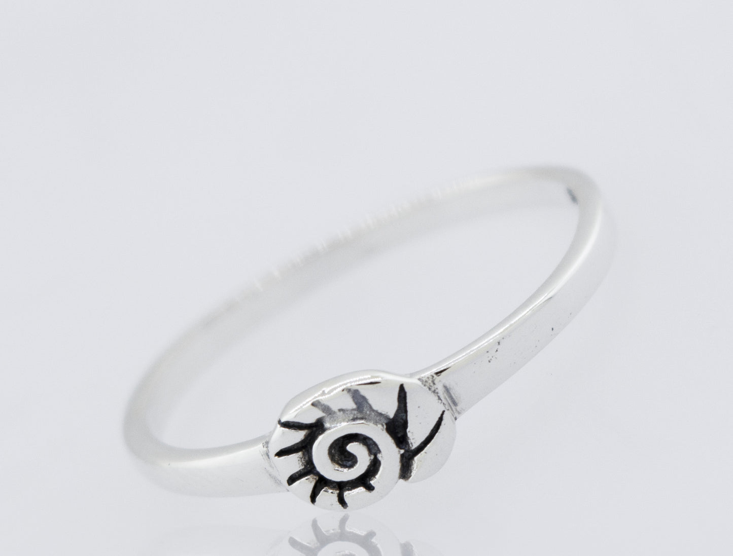 
                  
                    A Super Silver Shell Ring with a flower design.
                  
                