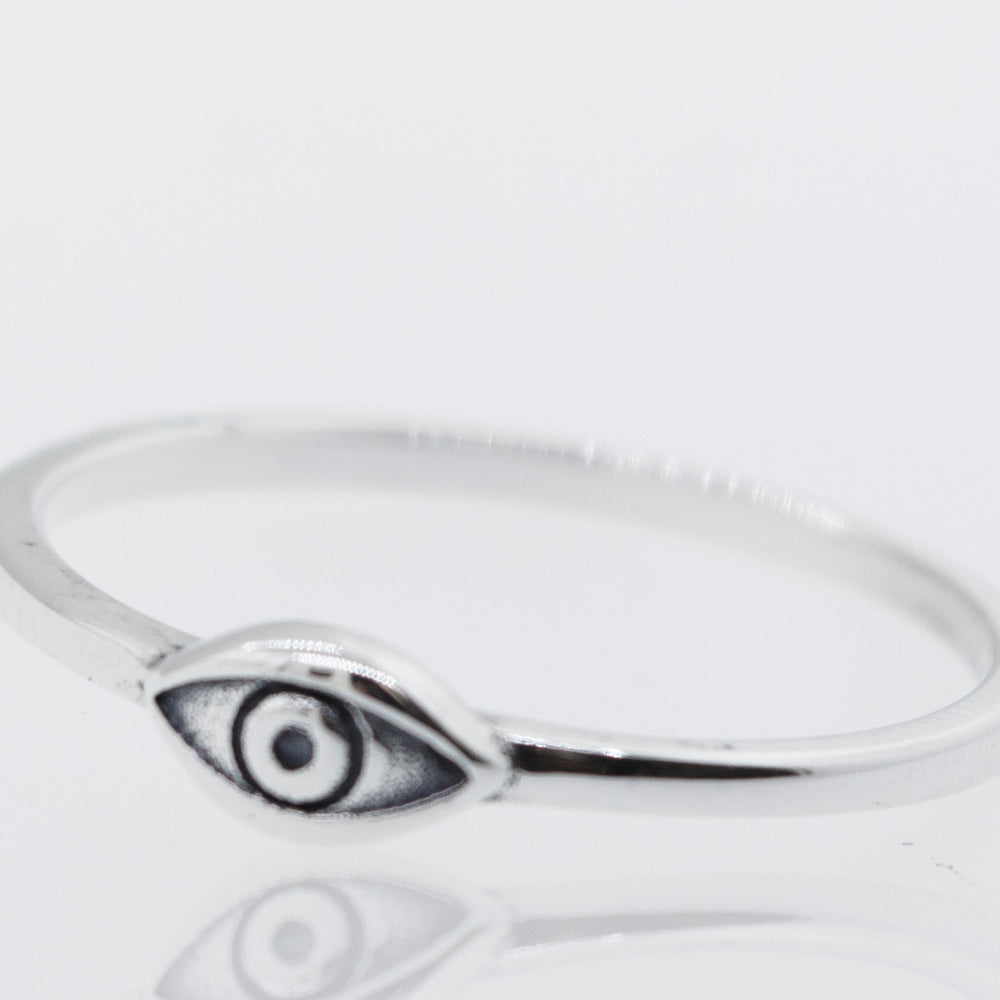 
                  
                    A minimalist Simple Eye Ring in silver with an evil eye.
                  
                