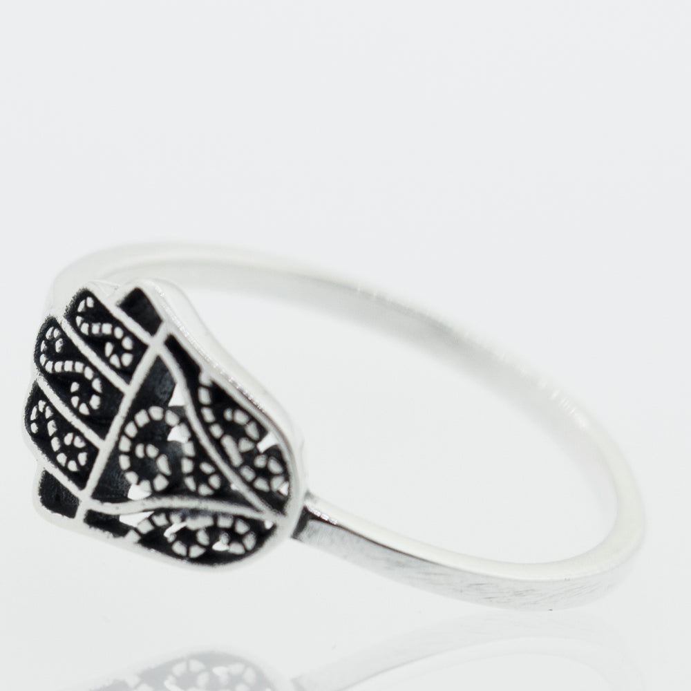
                  
                    A Hamsa Ring with Filigree Design with intricate cultural designs.
                  
                