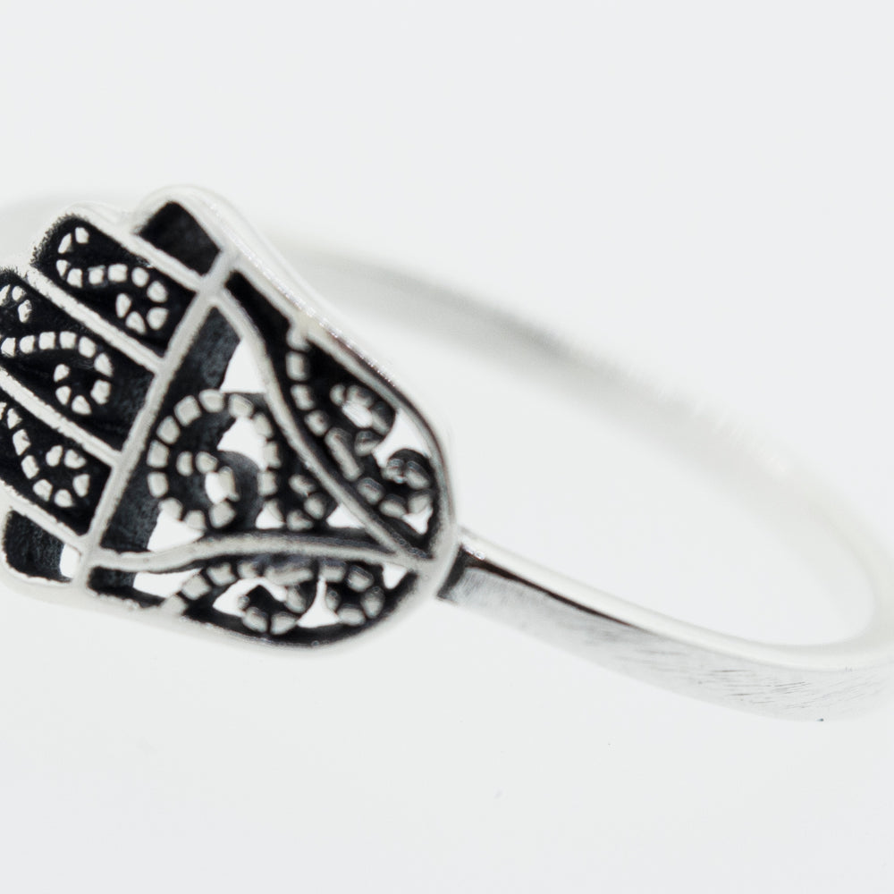 
                  
                    A cultural Hamsa Ring with filigree designs, representing Judaism.
                  
                