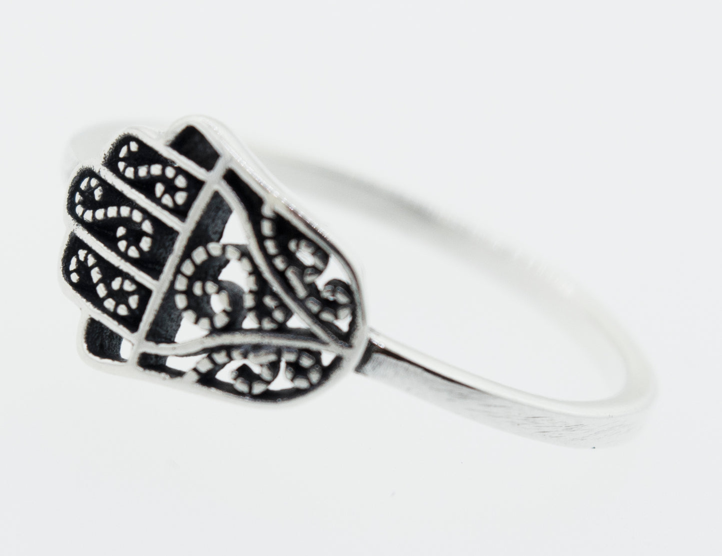 
                  
                    A cultural Hamsa Ring with filigree designs, representing Judaism.
                  
                