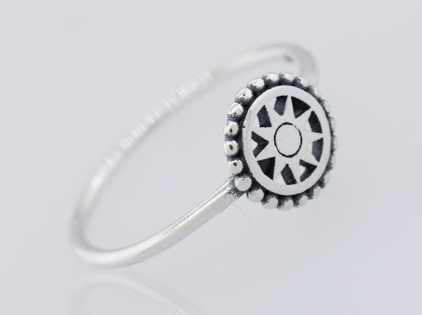
                  
                    A high polish 925 sterling silver Compass Ring by Super Silver featuring a sun wheel design.
                  
                
