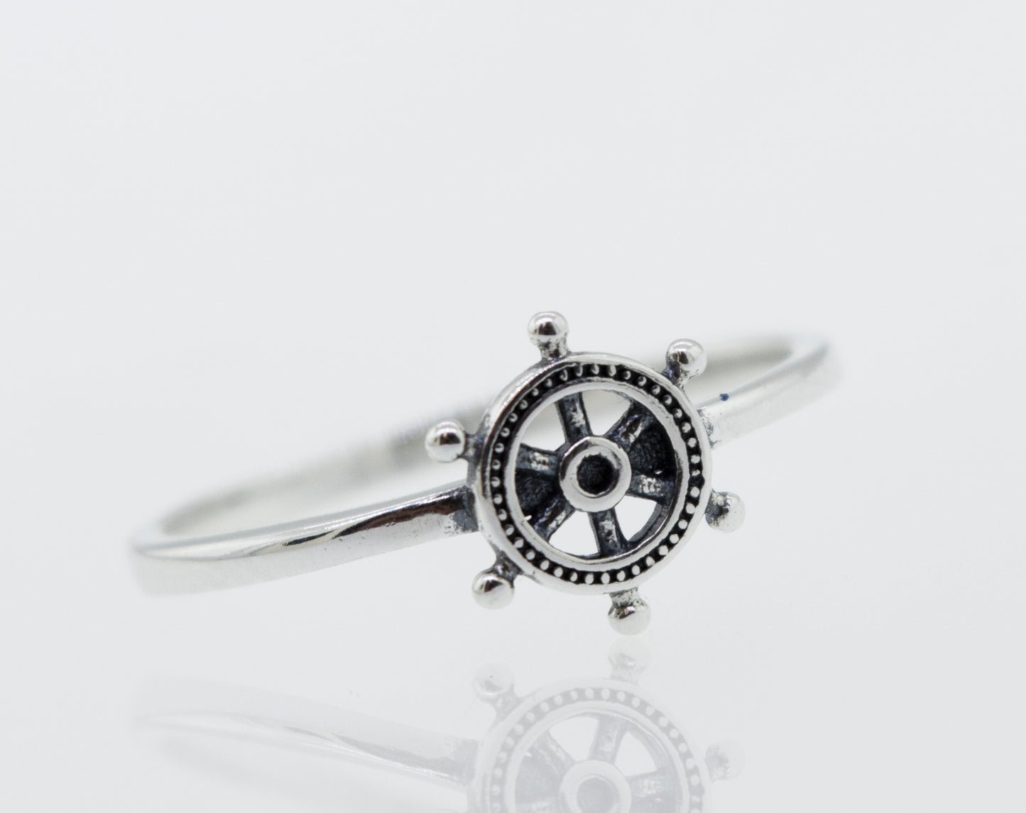 A Super Silver Silver Helm Ring with an oxidized ship wheel design.