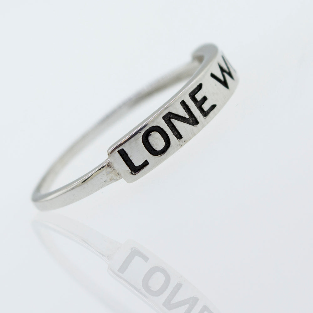 
                  
                    A Super Silver sterling silver Lone Wolf ring with the word love written on it.
                  
                